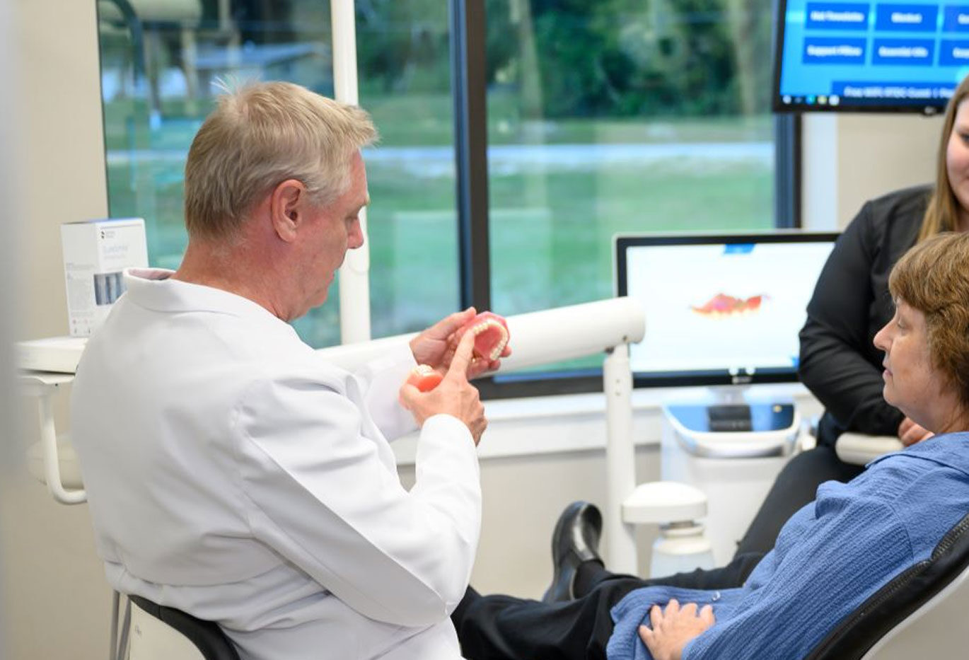 Dentist caring for a patient at Rivertown Dental