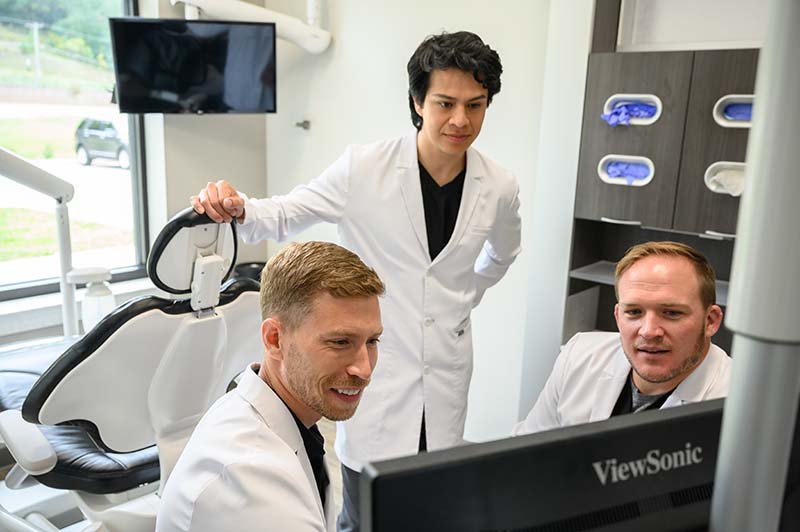 dentists reviewing dental case