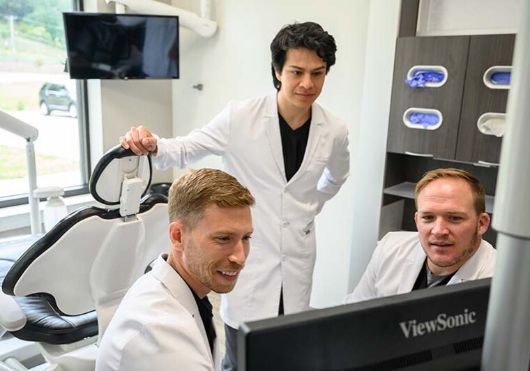 dentists reviewing dental case